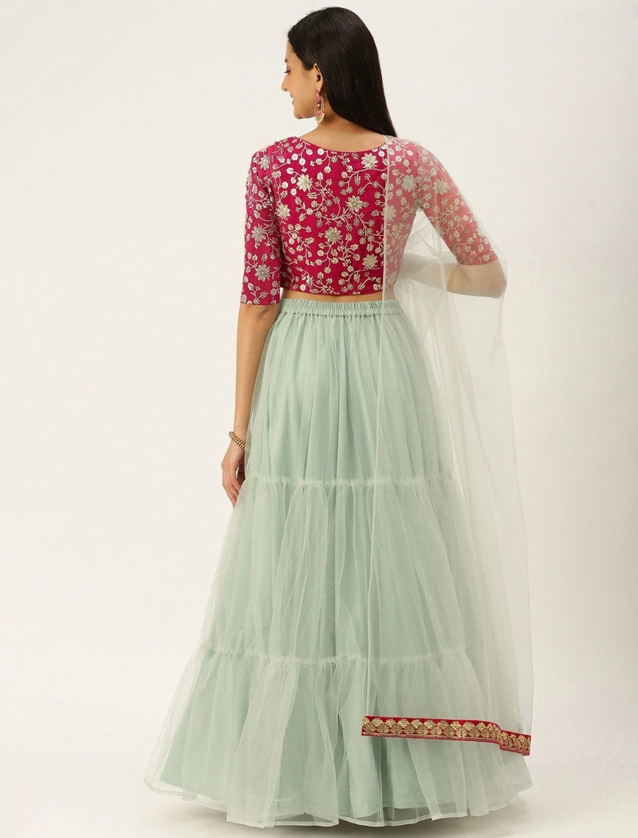 Dark pink and green ruffled lehenga choli and dupatta