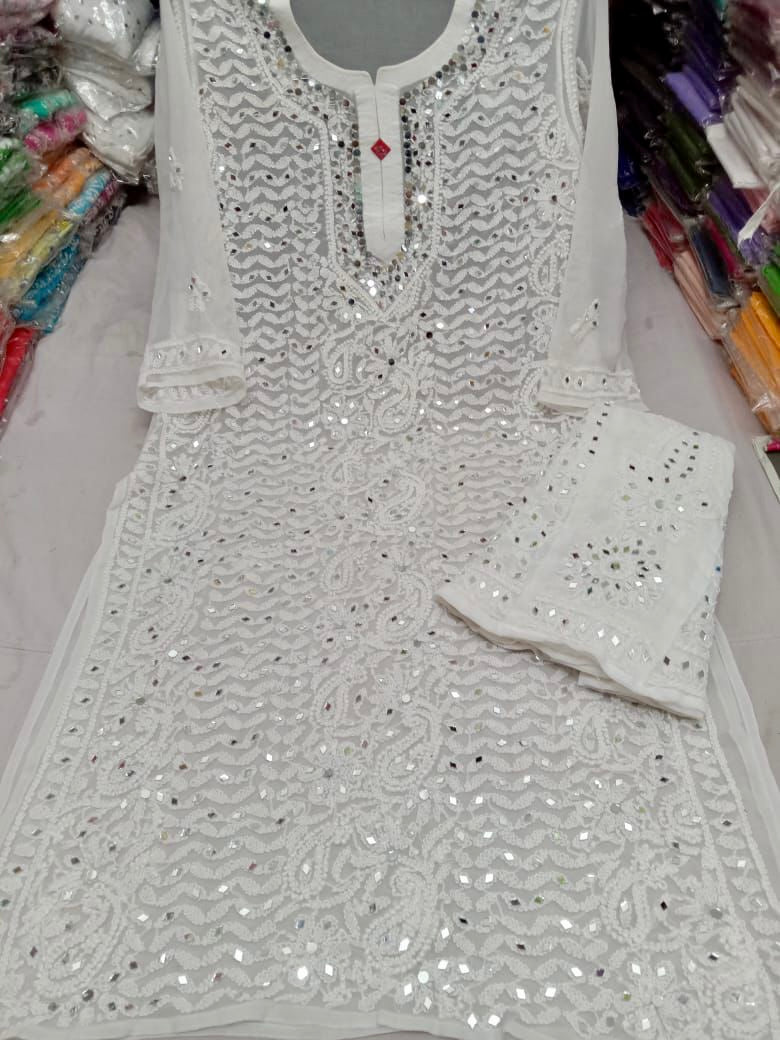 White heavy lucknowi and mirror work kurti with lining