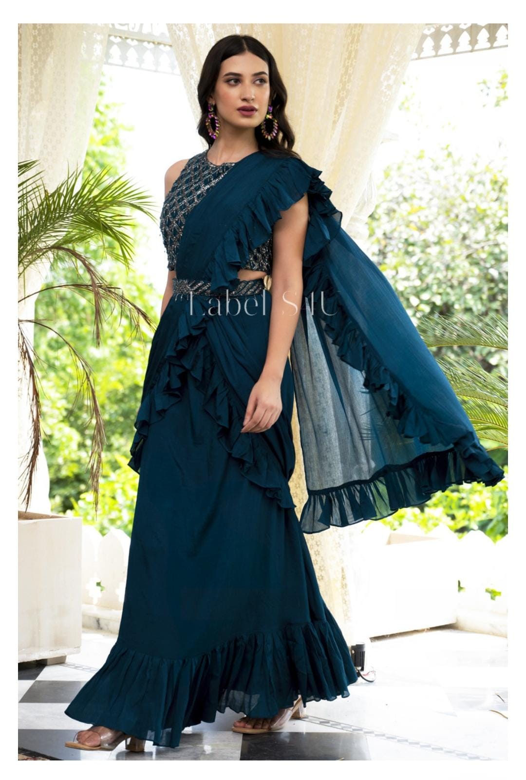 Teal heavy handwork blouse and belt predraped saree with frills