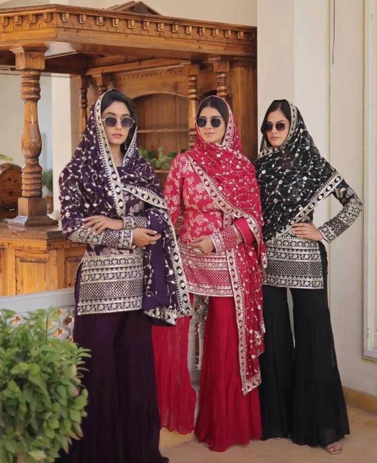 Dark pink sharara suit with heavy embroidered dupatta