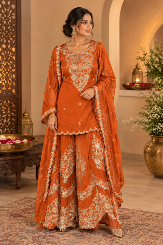 Orange elegant heavy looking light weight sharara suit