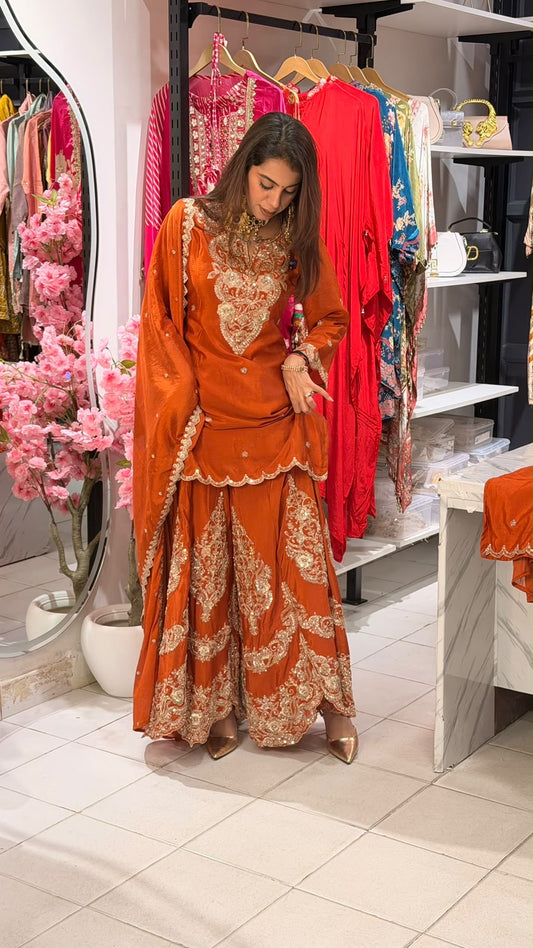 Orange elegant heavy looking light weight sharara suit
