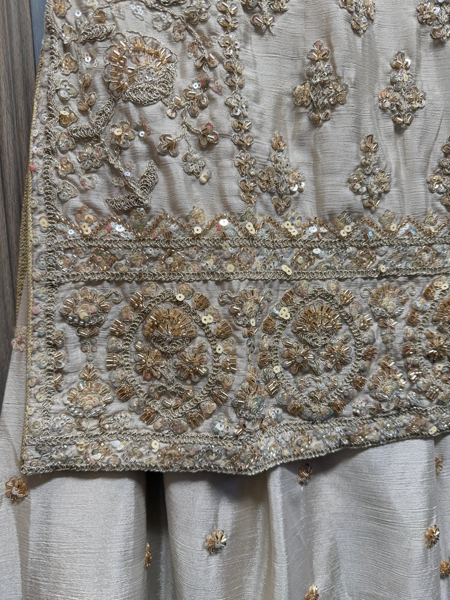 Beige and gold heavy handwork sharara suit
