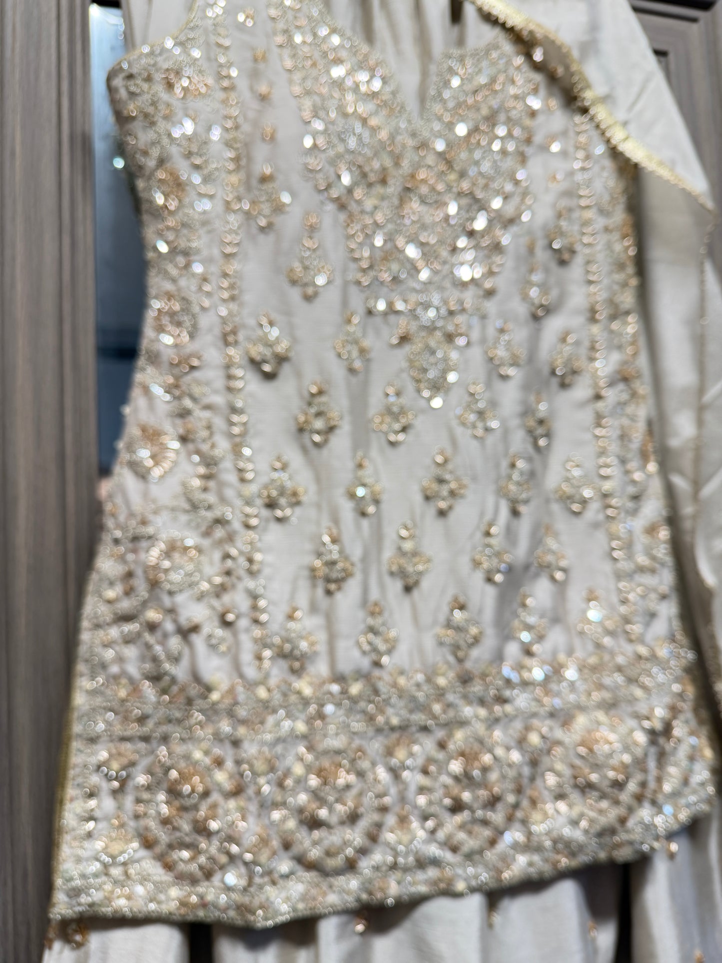 Beige and gold heavy handwork sharara suit