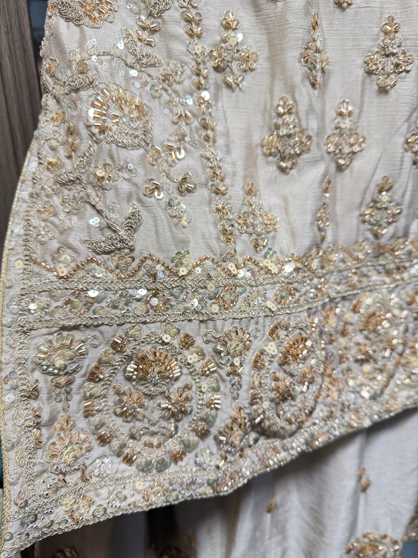 Beige and gold heavy handwork sharara suit