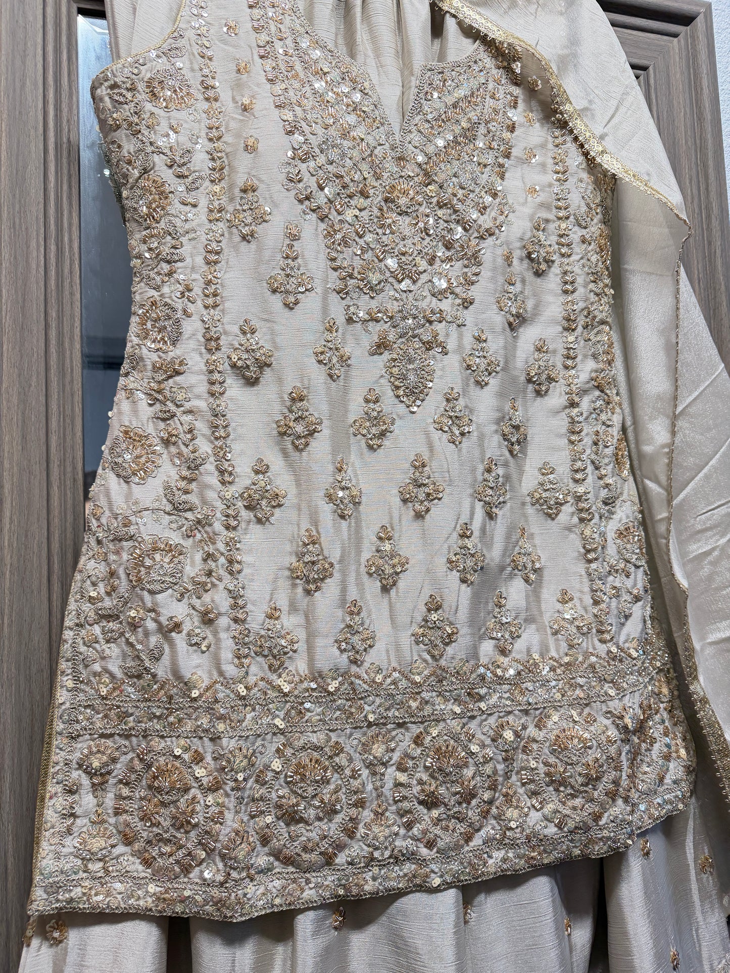 Beige and gold heavy handwork sharara suit