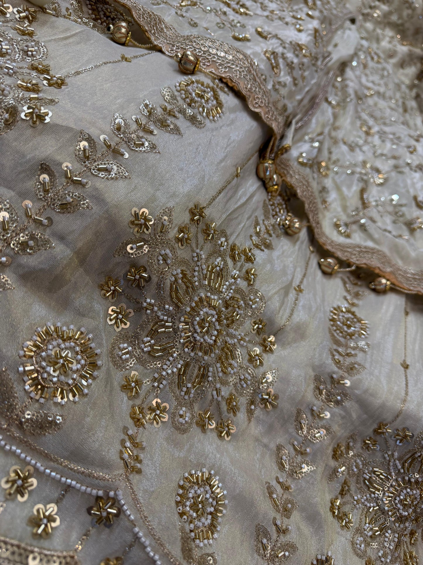 Golden heavy handwork tissue silk front slit lehenga
