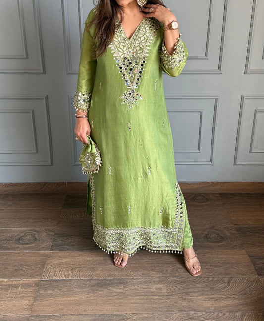 Green heavy real mirror work long co-ord set with potli bag
