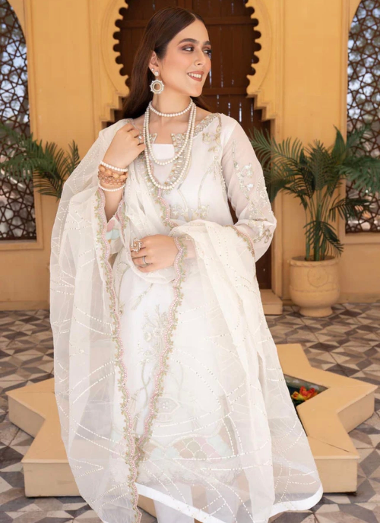White elegant handwork embroidered and sequence work suit