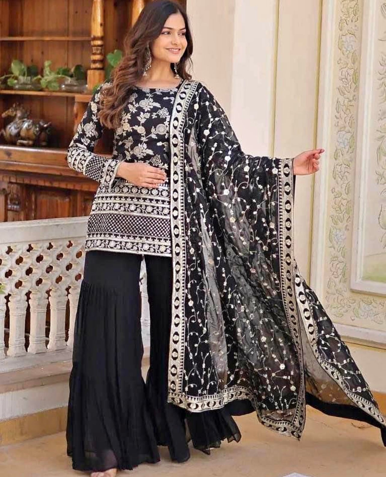 Black sharara suit with heavy embroidered dupatta