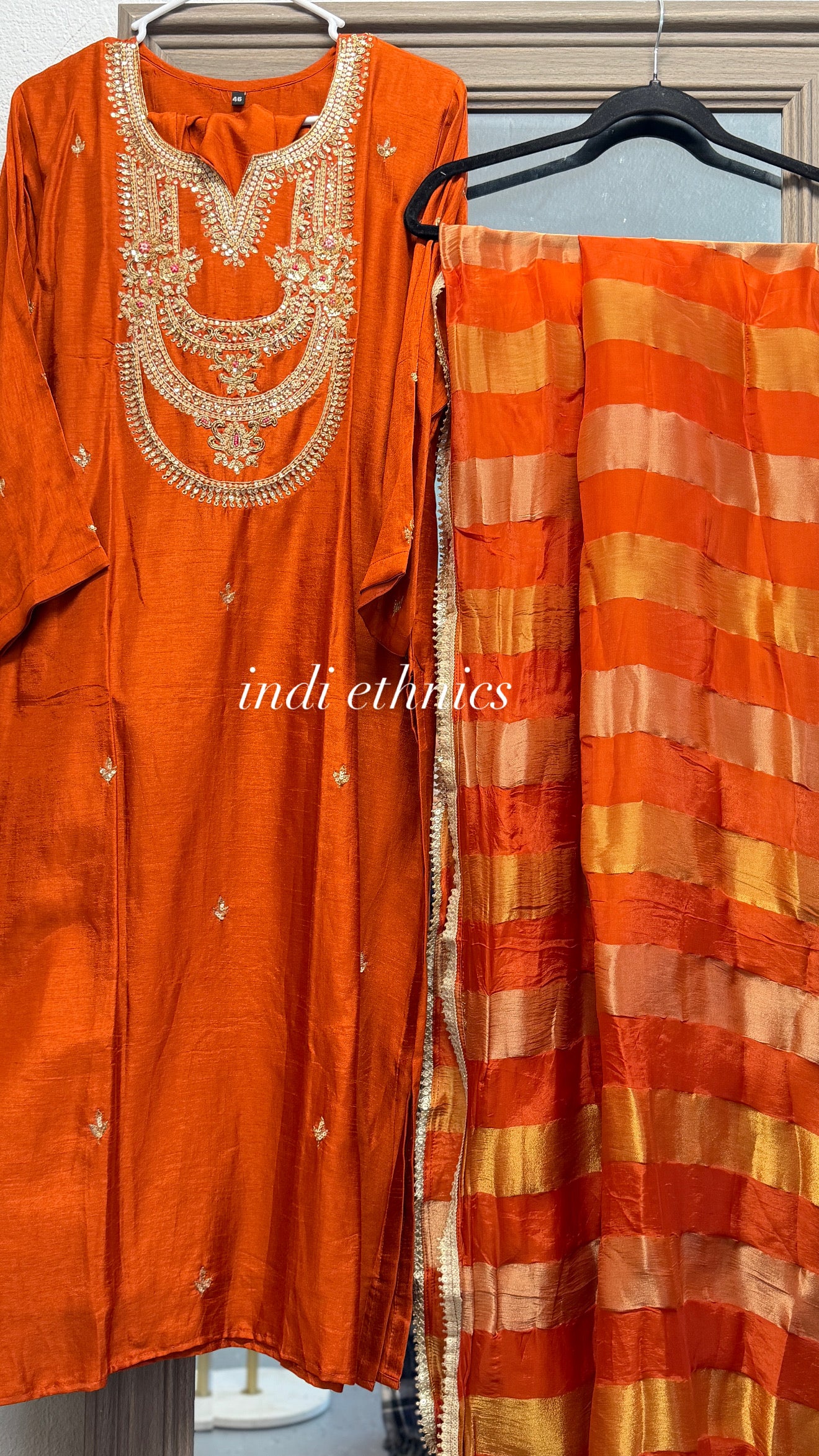 Rust orange pure dola silk suit with tissue dupatta