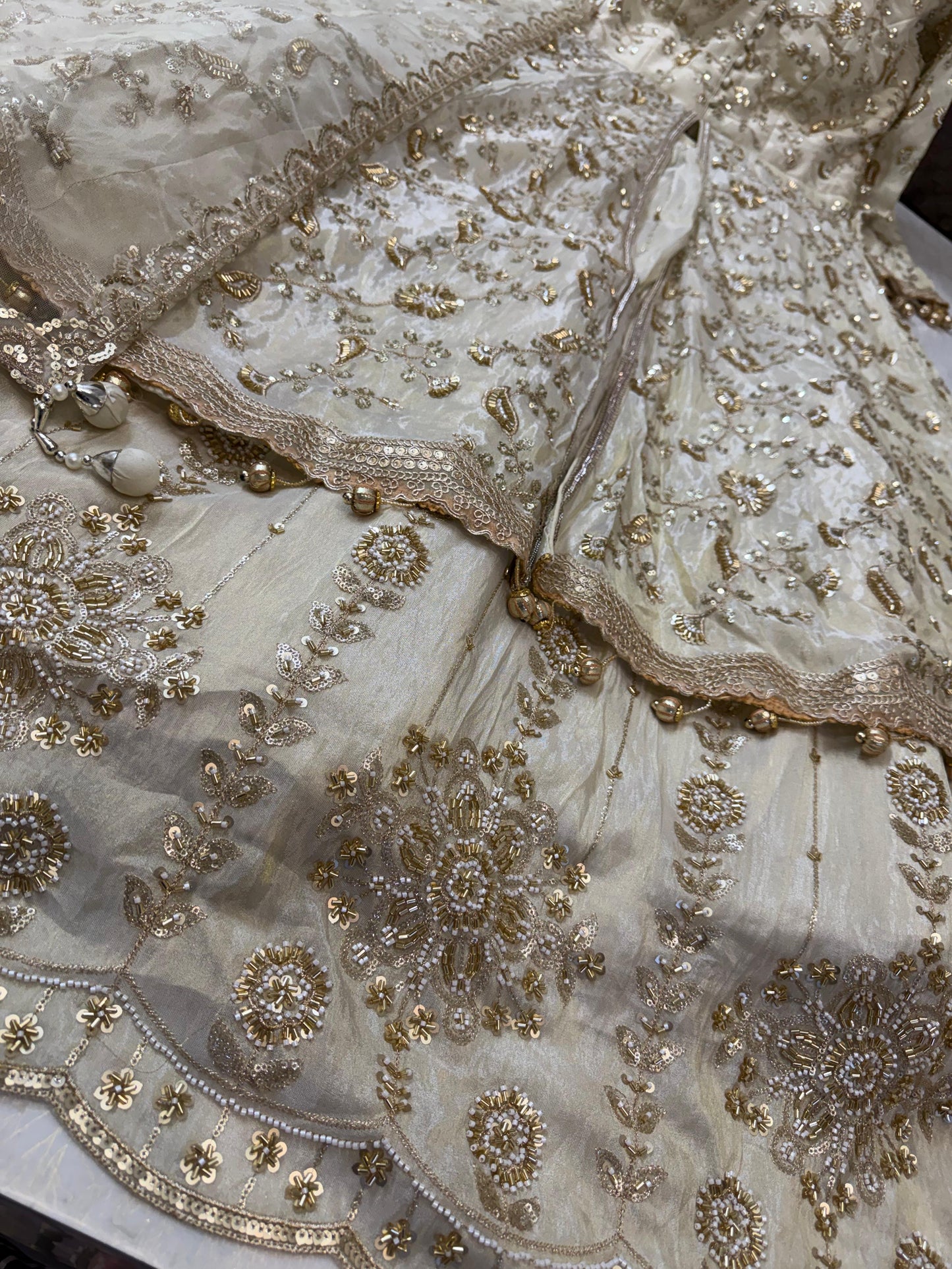 Golden heavy handwork tissue silk front slit lehenga
