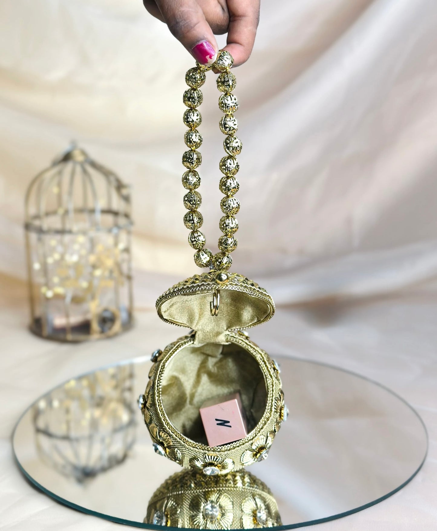 Gold round mini metal bag
