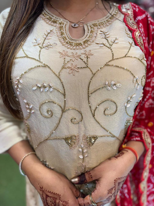 Off White heavy handwork shimmer tissue sharara set with red bandhni dupatta