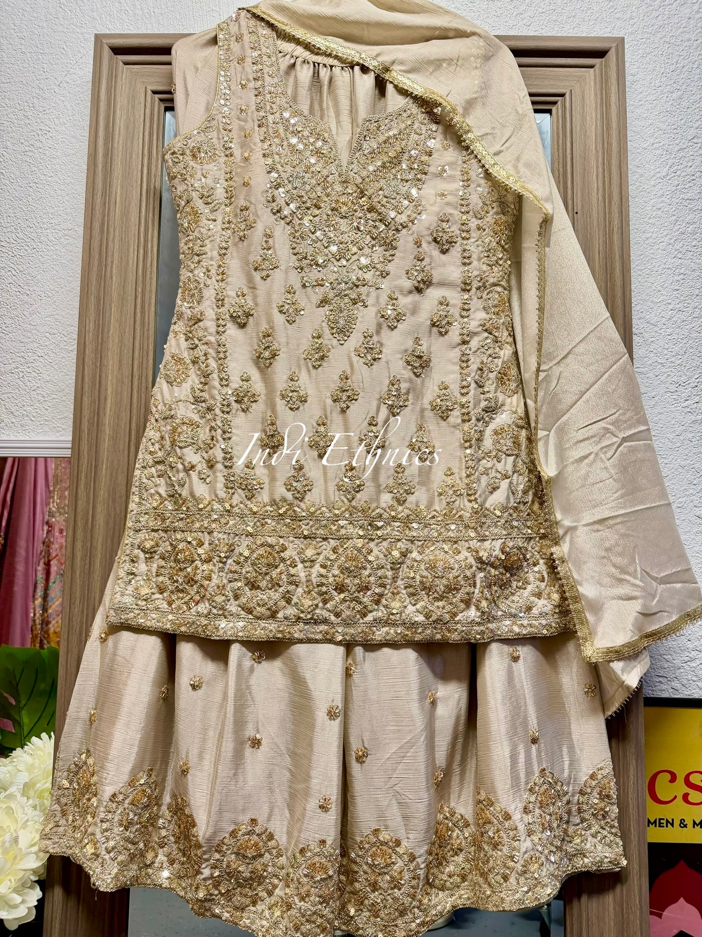 Beige and gold heavy handwork sharara suit