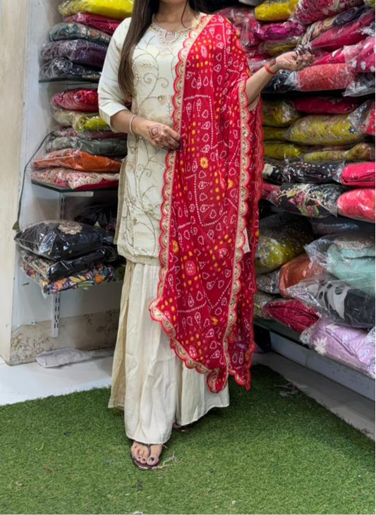Off White heavy handwork shimmer tissue sharara set with red bandhni dupatta